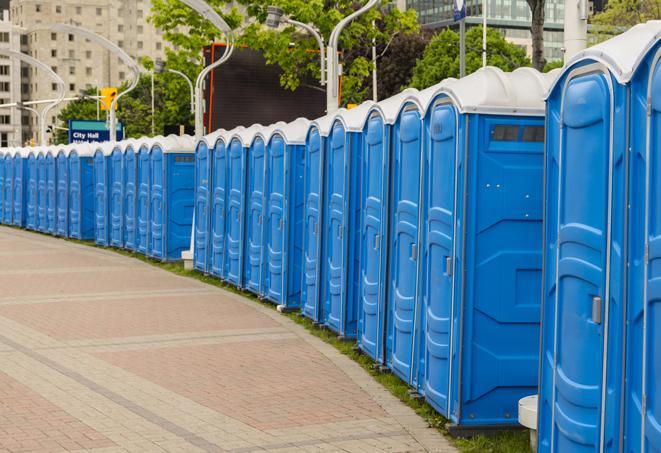 a row of portable restrooms at a fairground, offering visitors a clean and hassle-free experience in portisabel